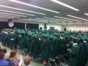 crowd of graduates in emerald